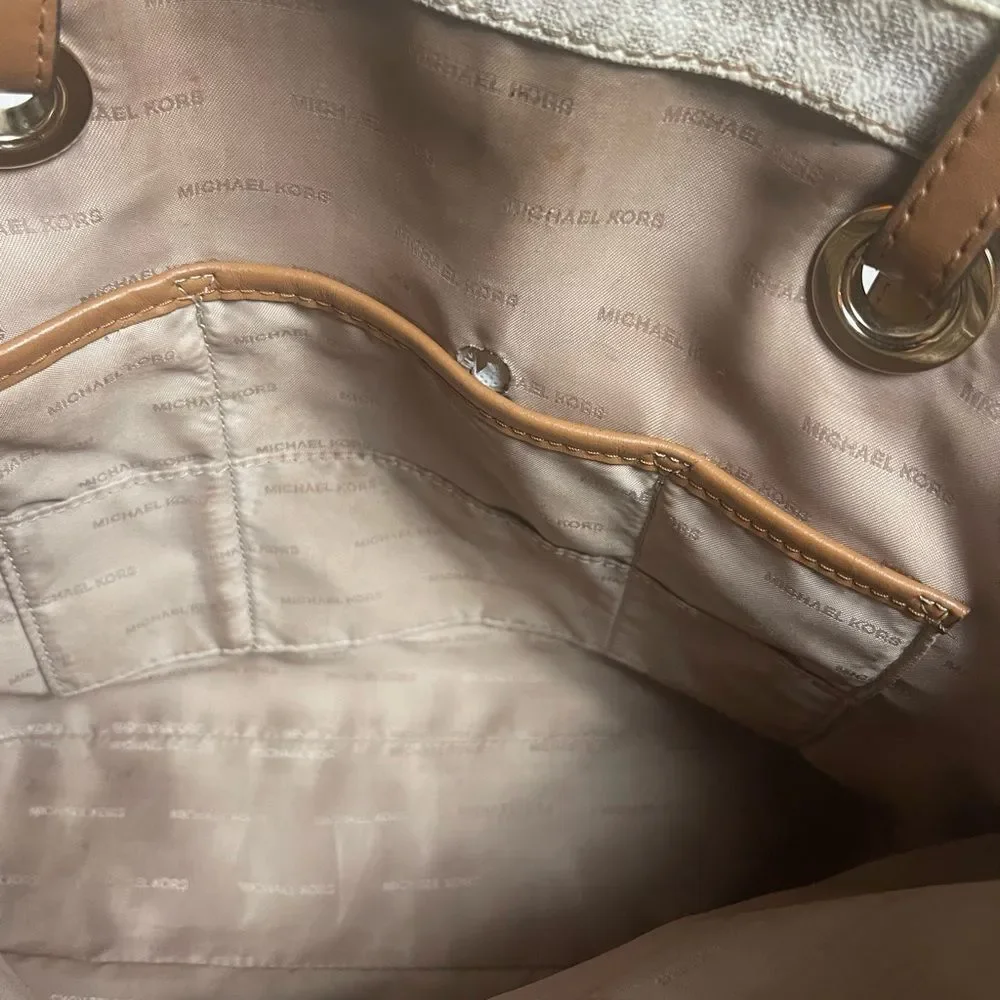 Michael Kors Beige signature Coated Canvas tote , tan leather straps .